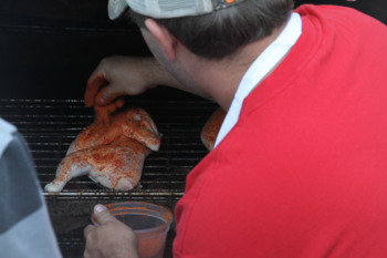 Meat Merchandising student seasoning poultry
