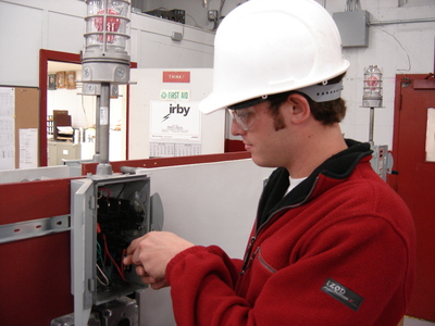 CTE student fixing technical equipment